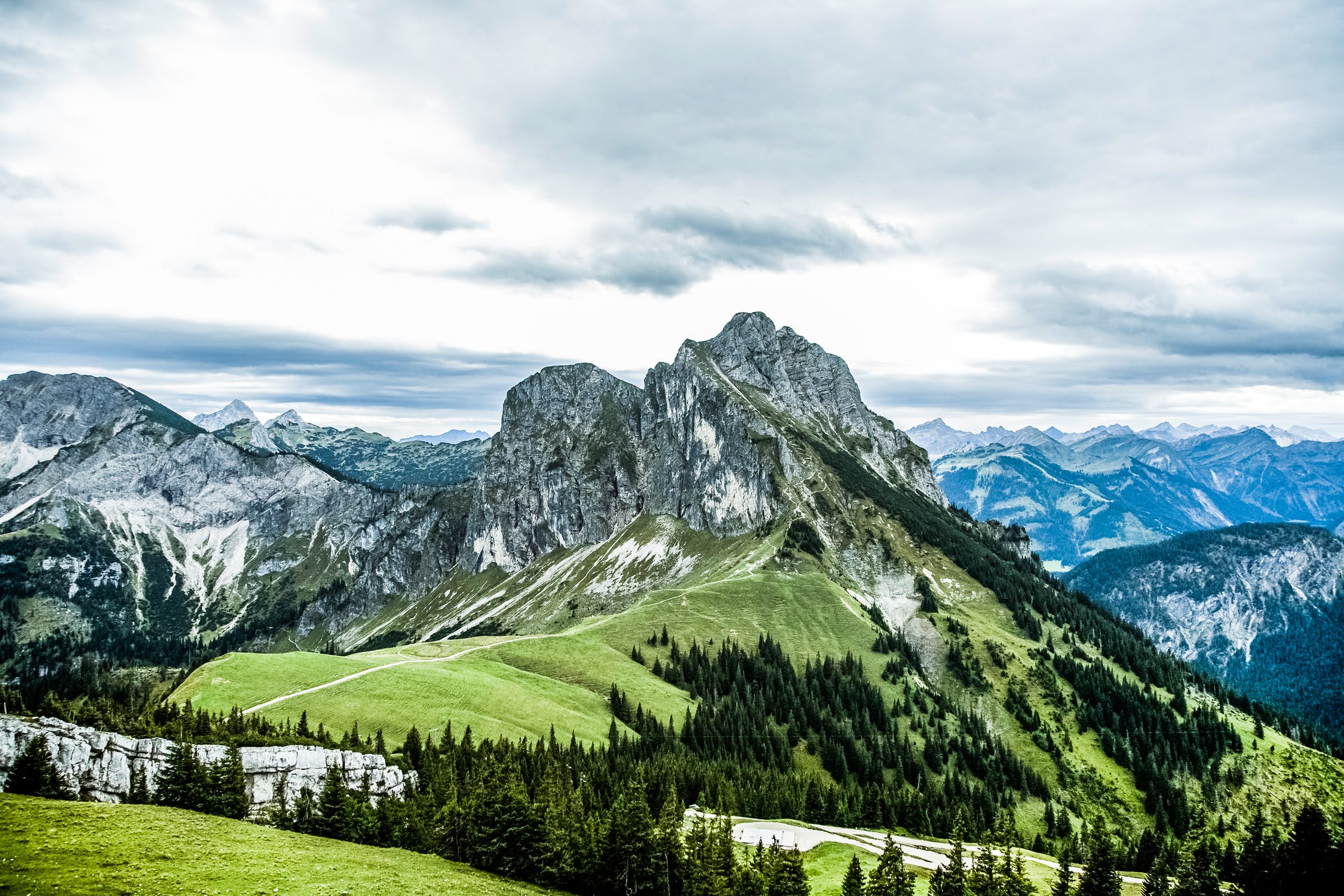 Grassy alpine ridge beneath a broad sky
